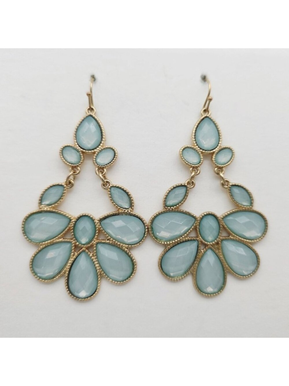 Gold Tone Teardrop Dangle Earrings With Light Blue Faceted Stones